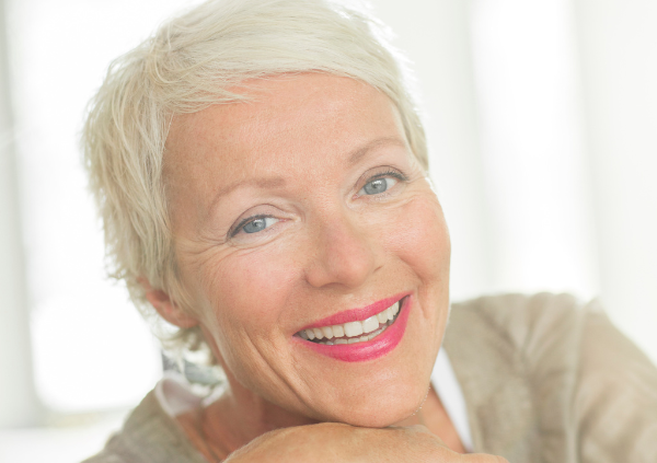 Smiling woman, online hypnotherapy for cancer